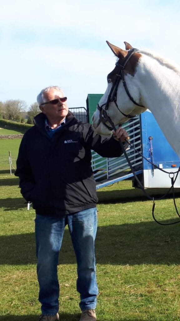 Dave Lockett, founder of EquineSolar, standing with a horse